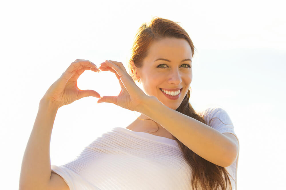 Woman making a heart with her hand